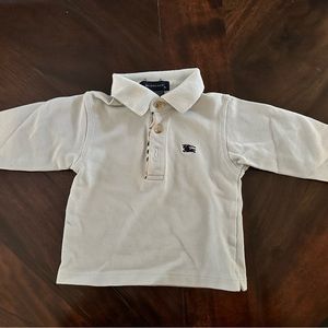 Light blue polo long sleeve Burberry shirt. Excellent condition! Size 6months